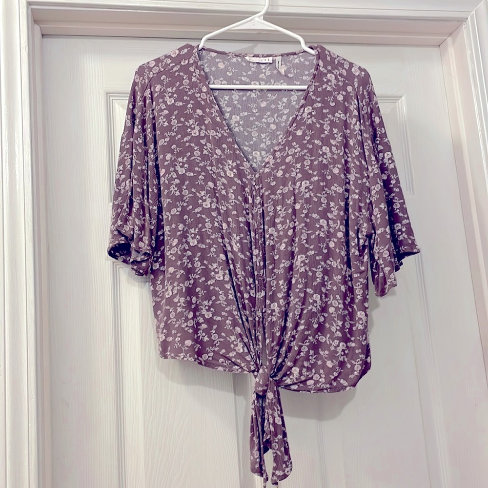 LUQ Rhee floral crop top with adjustable tie front.